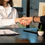 business handshake in modern office