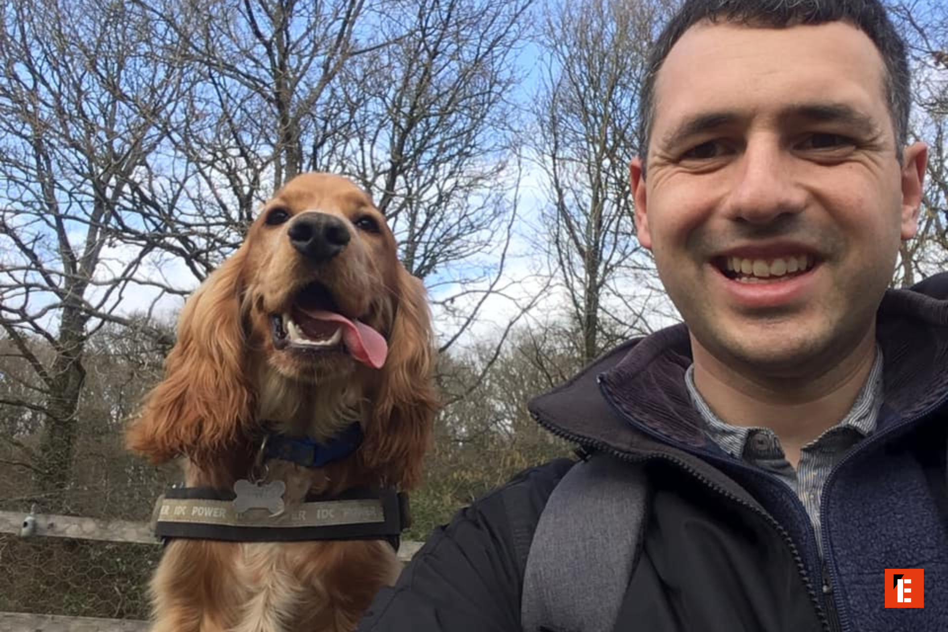 dog and a men smiling