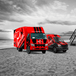 camión y furgoneta en una playa de mybike