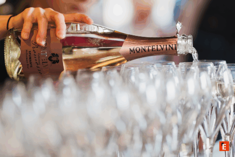 someone serving glasses