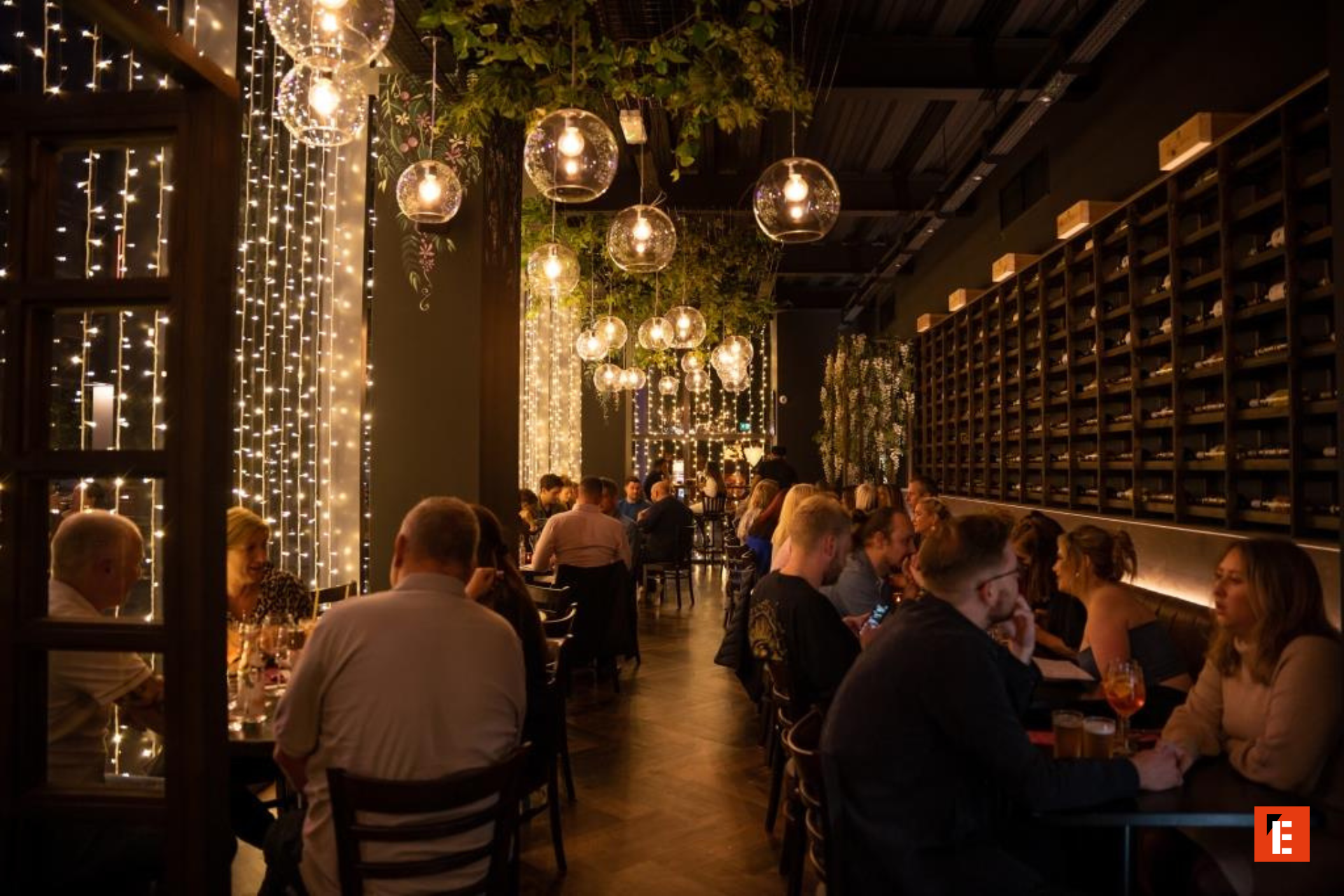 Elegant restaurant interior with dim lighting and patrons.