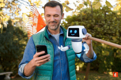 Homme souriant avec un robot virtuel dans le jardin.
