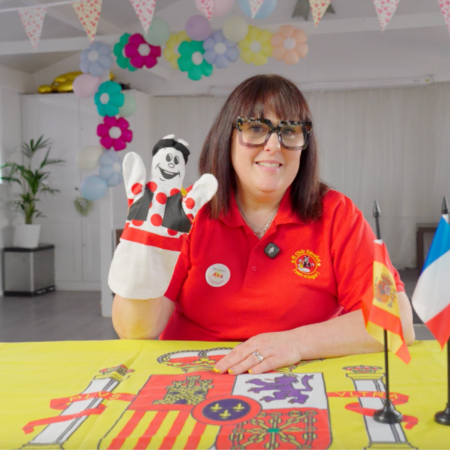 portrait of smiling woman in red polo shirt