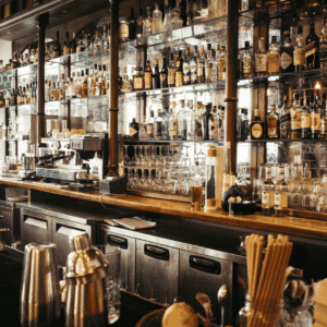 interior of a bar with the counter, drinks and bottles