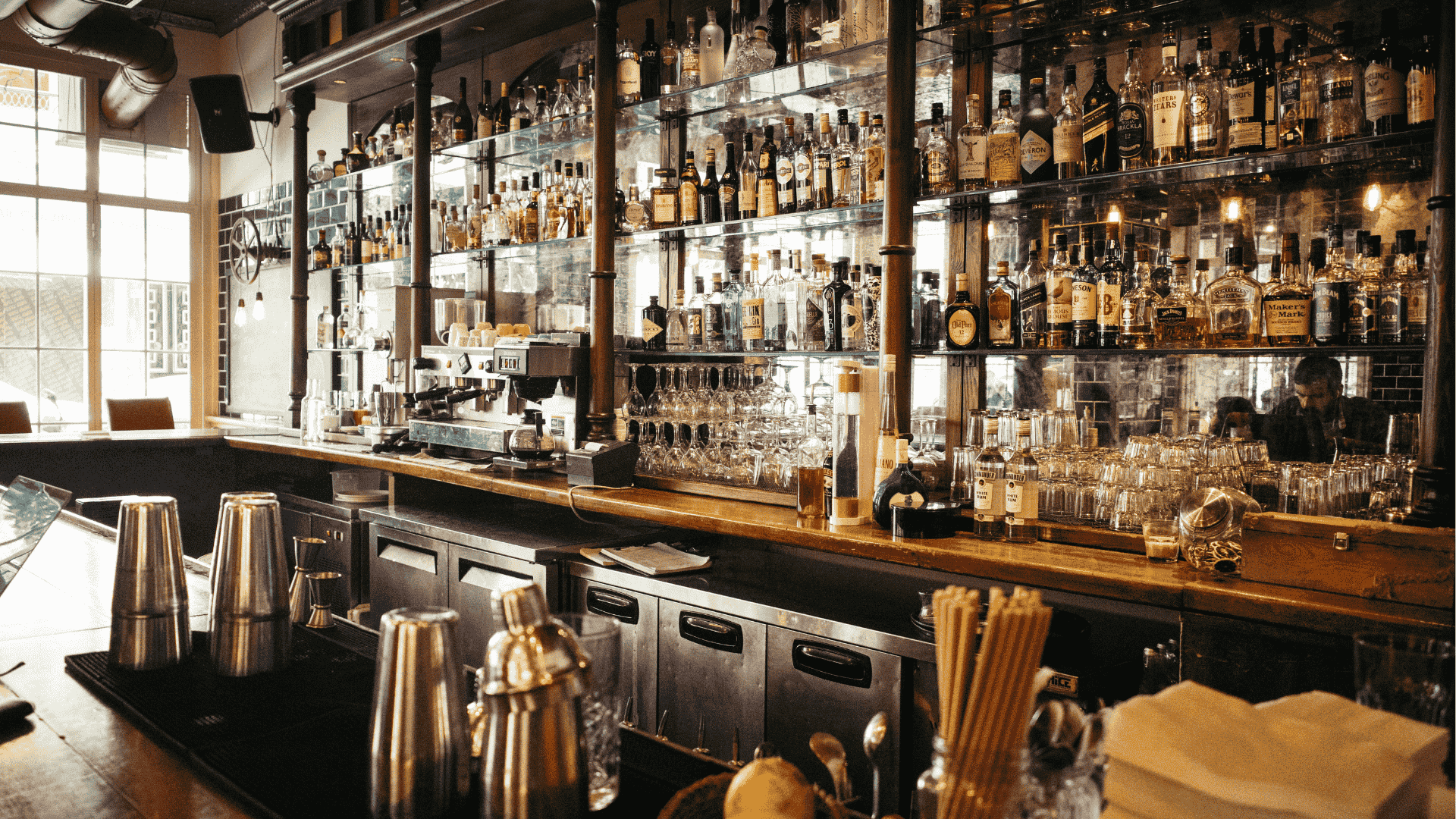 interior of a bar with the counter, drinks and bottles