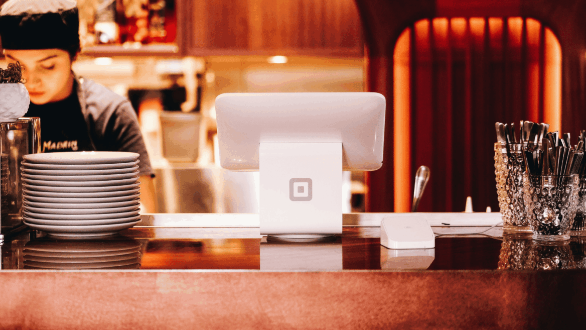 restaurant counter with a lady restaurant worker on the left side