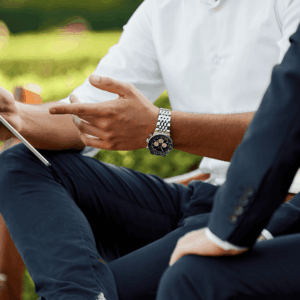 close up on two business men discussing a project