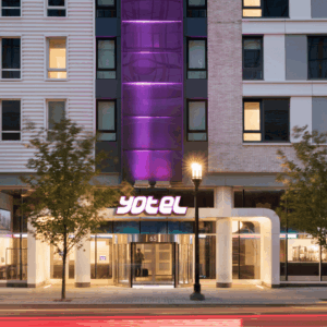 yotel 65 hotel exterior at dusk with purple lighting