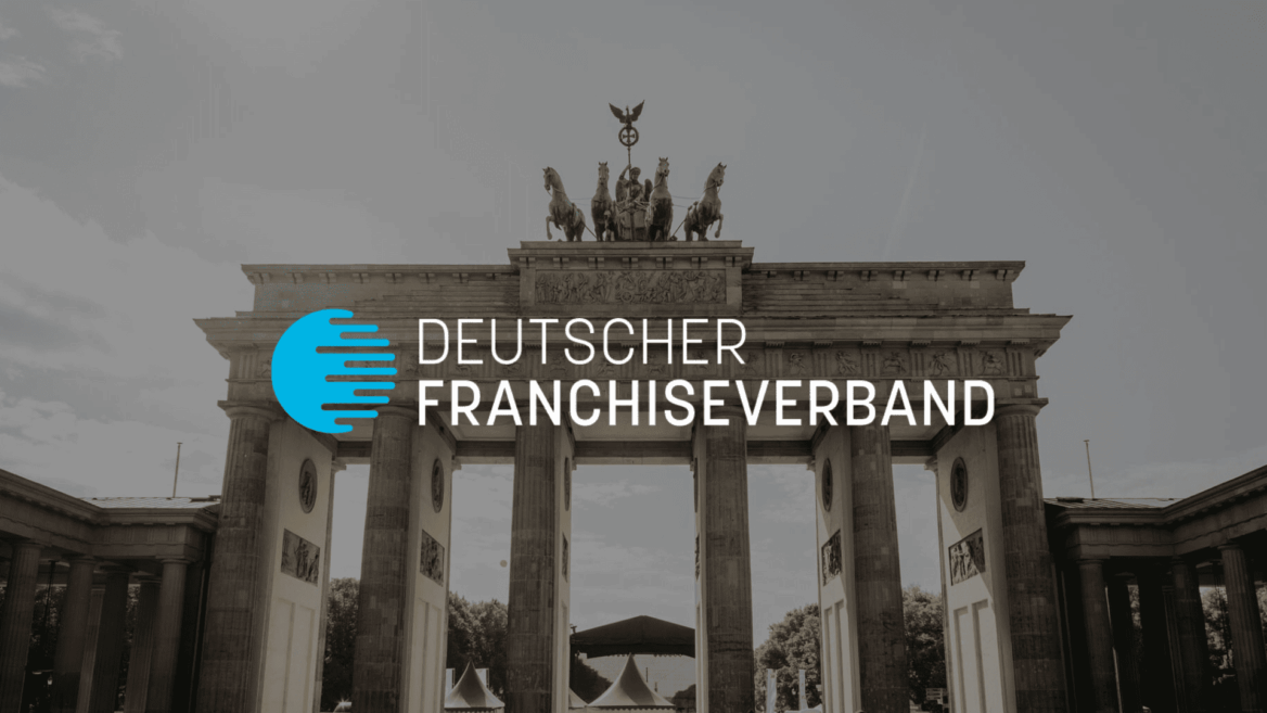 brandenburger tor berlin mit deutschem franchiseverband logo