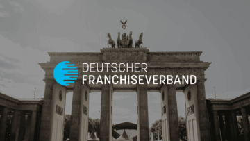 brandenburger tor berlin mit deutschem franchiseverband logo