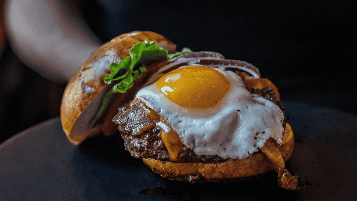 brioche burger with fried egg and bacon