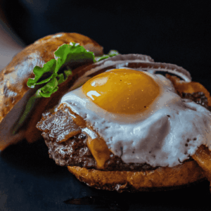 brioche burger with fried egg and bacon