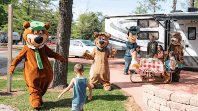family picnic with bear mascots at rv campground
