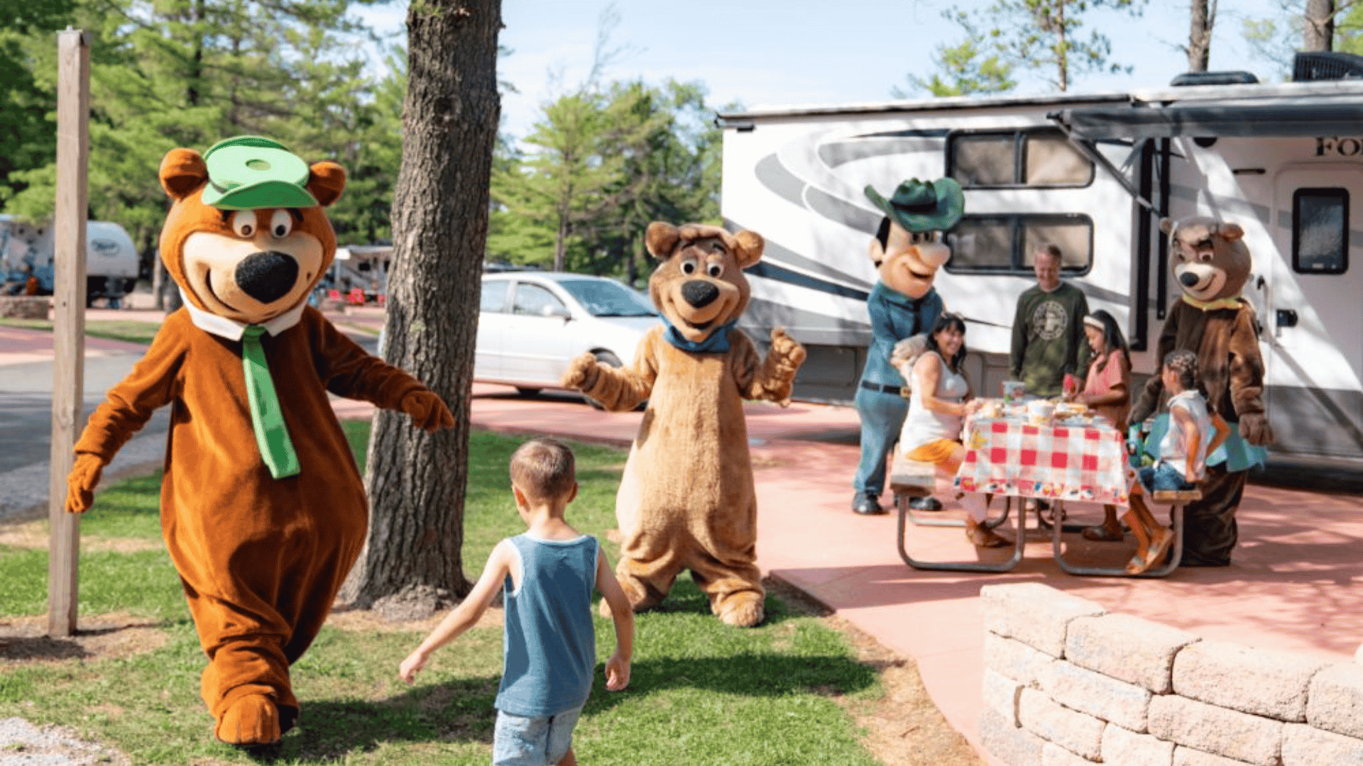 family picnic with bear mascots at rv campground