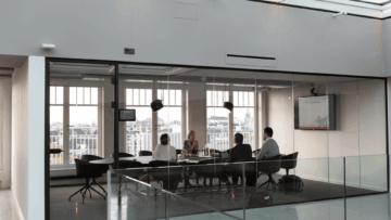 modern glass conference room for hybrid meetings