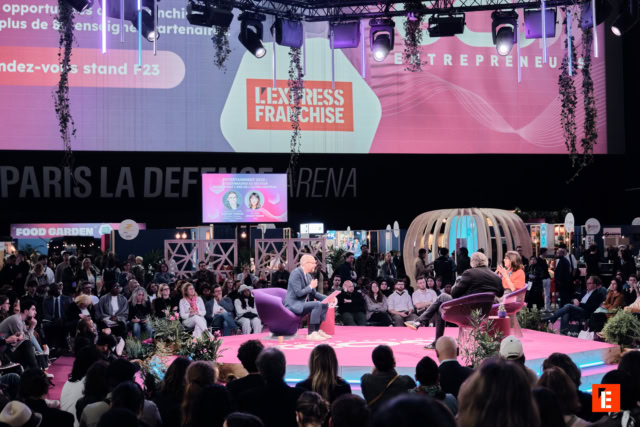 franchise conference panel on magenta stage