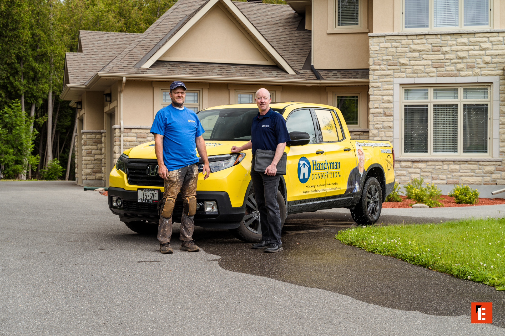 yellow handyman truck and crew at suburban home