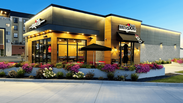 modern restaurant patio at dusk with warm lighting
