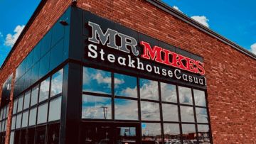 mr mikes steakhouse: red sign on brick facade