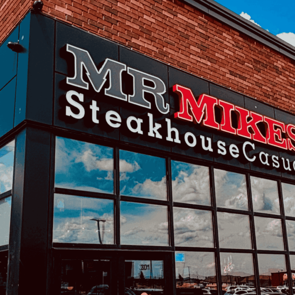 mr mikes steakhouse: red sign on brick facade