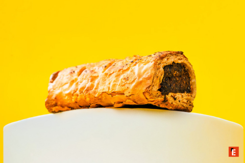 golden flaky pastry roll with dark filling
