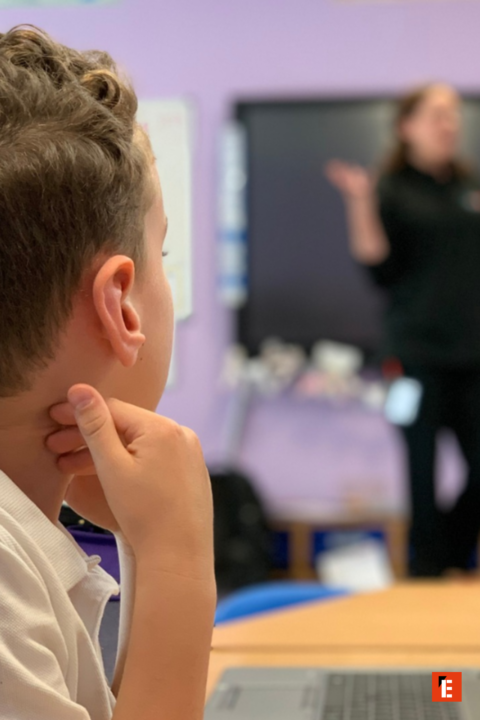 attentive student listening during classroom lesson