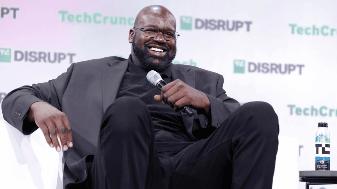 smiling techcrunch disrupt speaker on stage