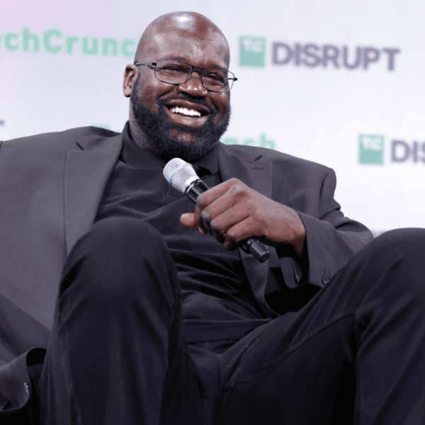 smiling techcrunch disrupt speaker on stage