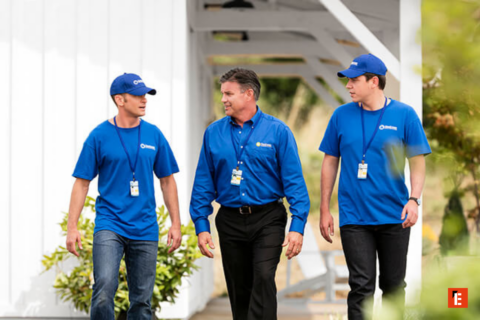 outdoor team in blue uniforms walking together