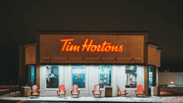 tim hortons at night: neon sign and snowy red chairs