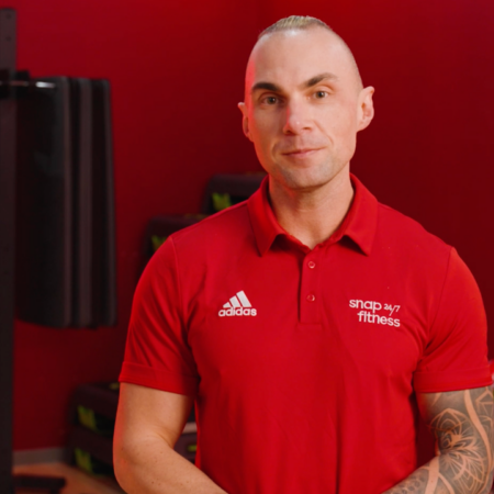 gym personal trainer portrait in red polo