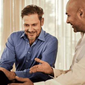 two colleagues collaborating over a laptop
