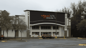 urban air adventure park exterior, empty parking lot