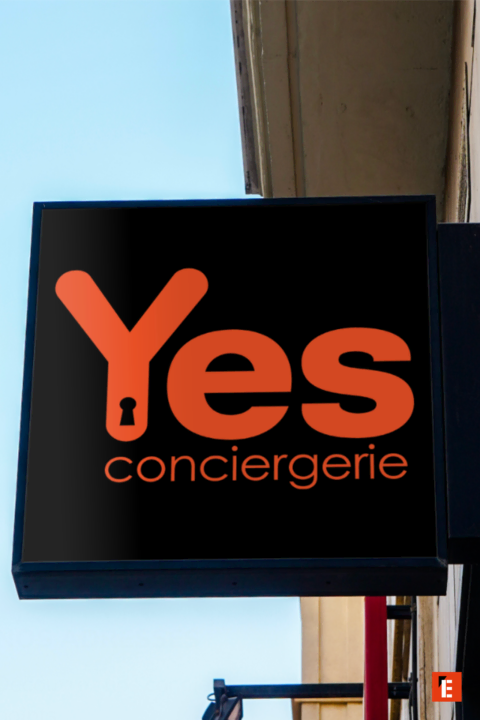 enseigne yes conciergerie orange sur fond noir