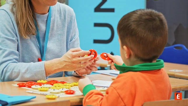 hands on learning: adult and child sorting tokens
