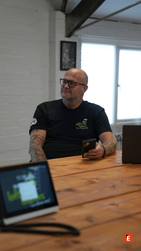 bald man in modern office meeting