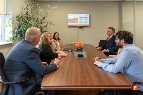 boardroom meeting: team reviewing data presentation