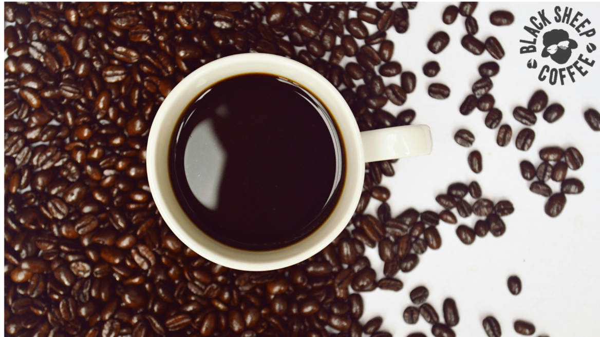 top view coffee cup and beans — black sheep coffee