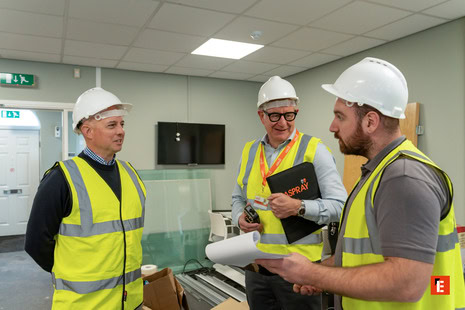 construction team reviewing on site plans