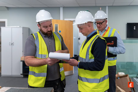 construction safety team reviewing on site plans