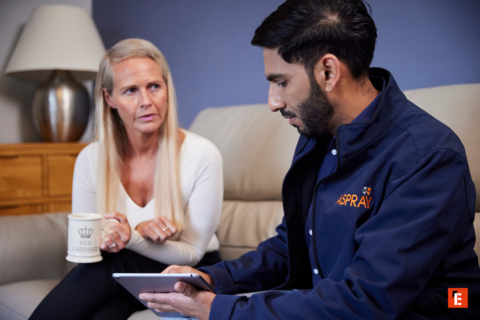 couple using tablet in cozy living room