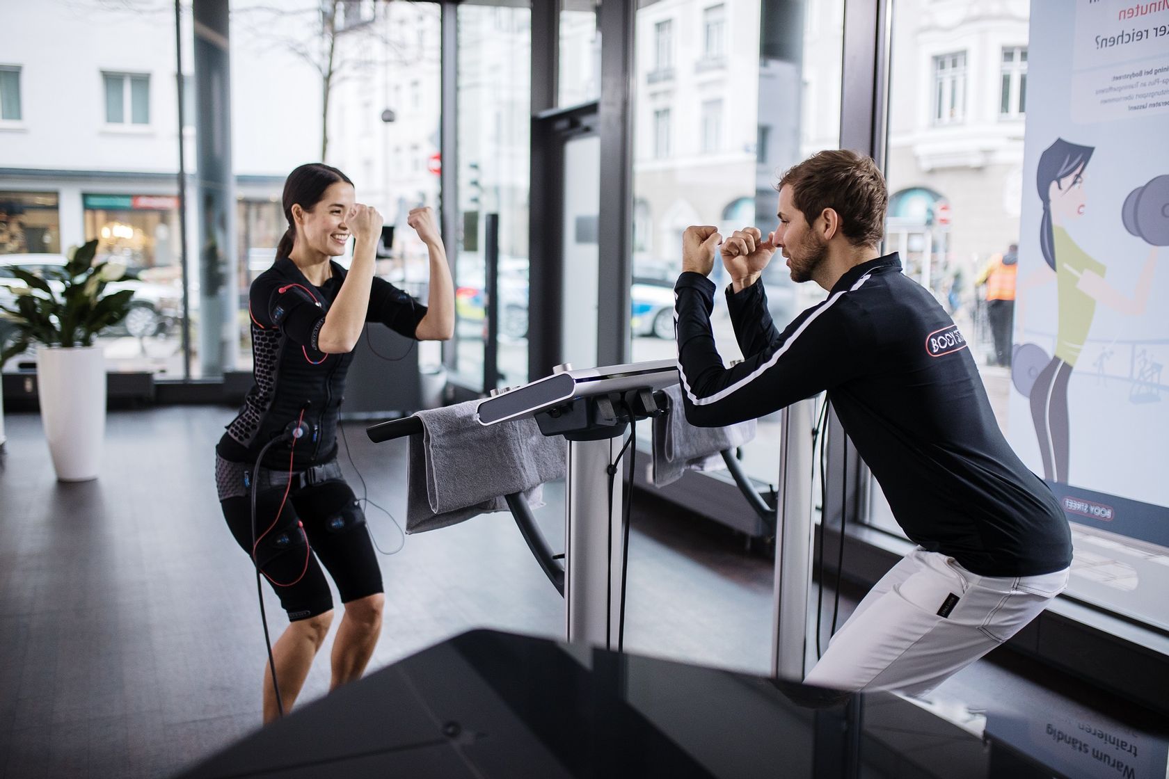 couple ems workout on vibration platform