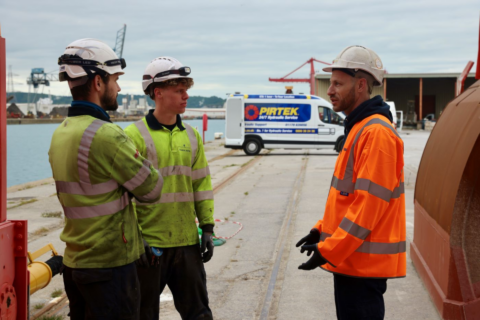 dockside safety briefing at industrial harbor