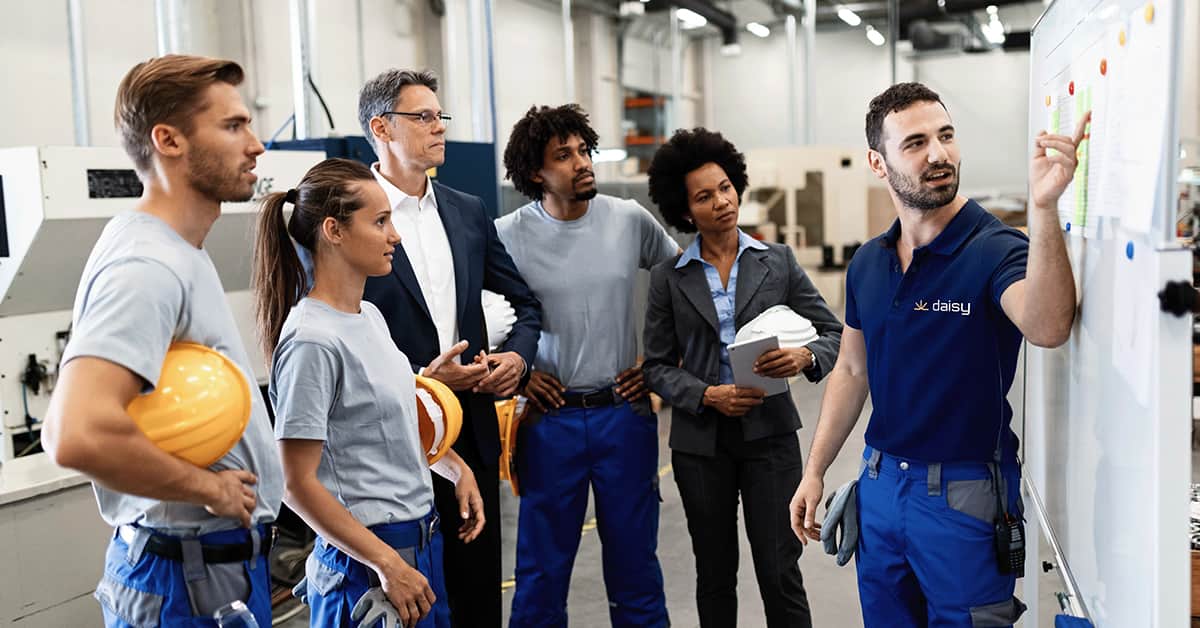manufacturing team briefing on the factory floor