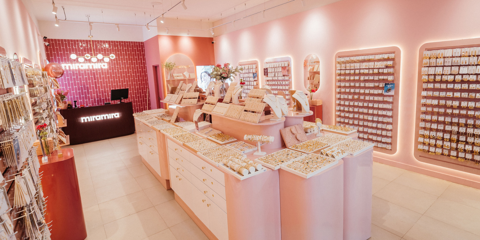 pink jewelry boutique interior with display islands