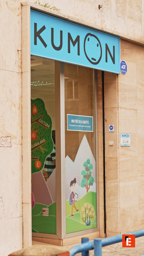 kumon learning center with turquoise sign and decals