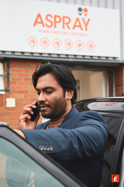 businessman on phone outside aspray manchester