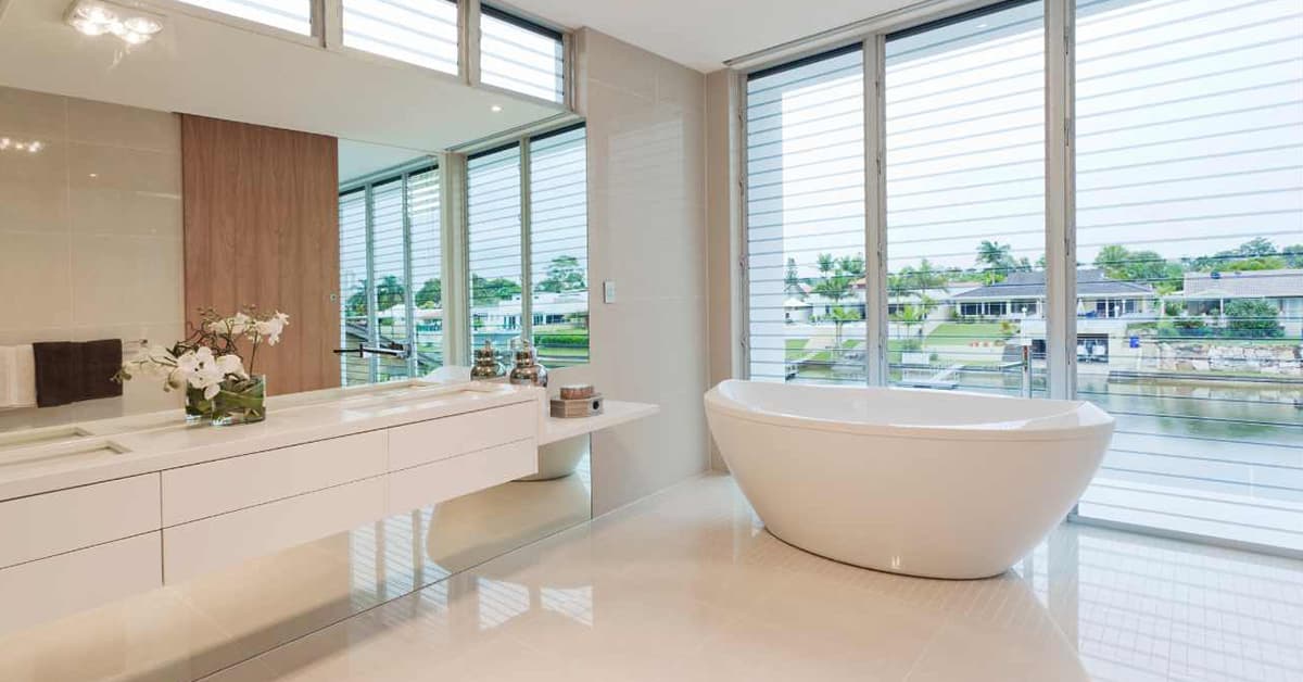 waterfront spa bathroom with freestanding tub
