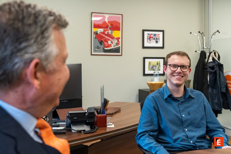 smiling young professional in casual office meeting