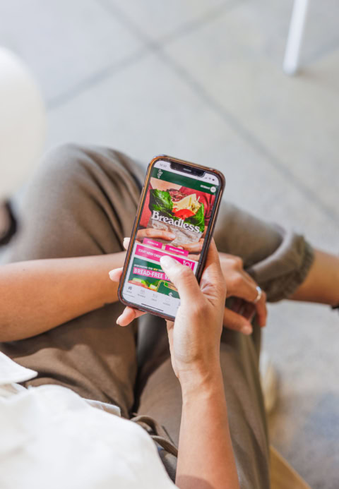 using breadless food ordering app on smartphone